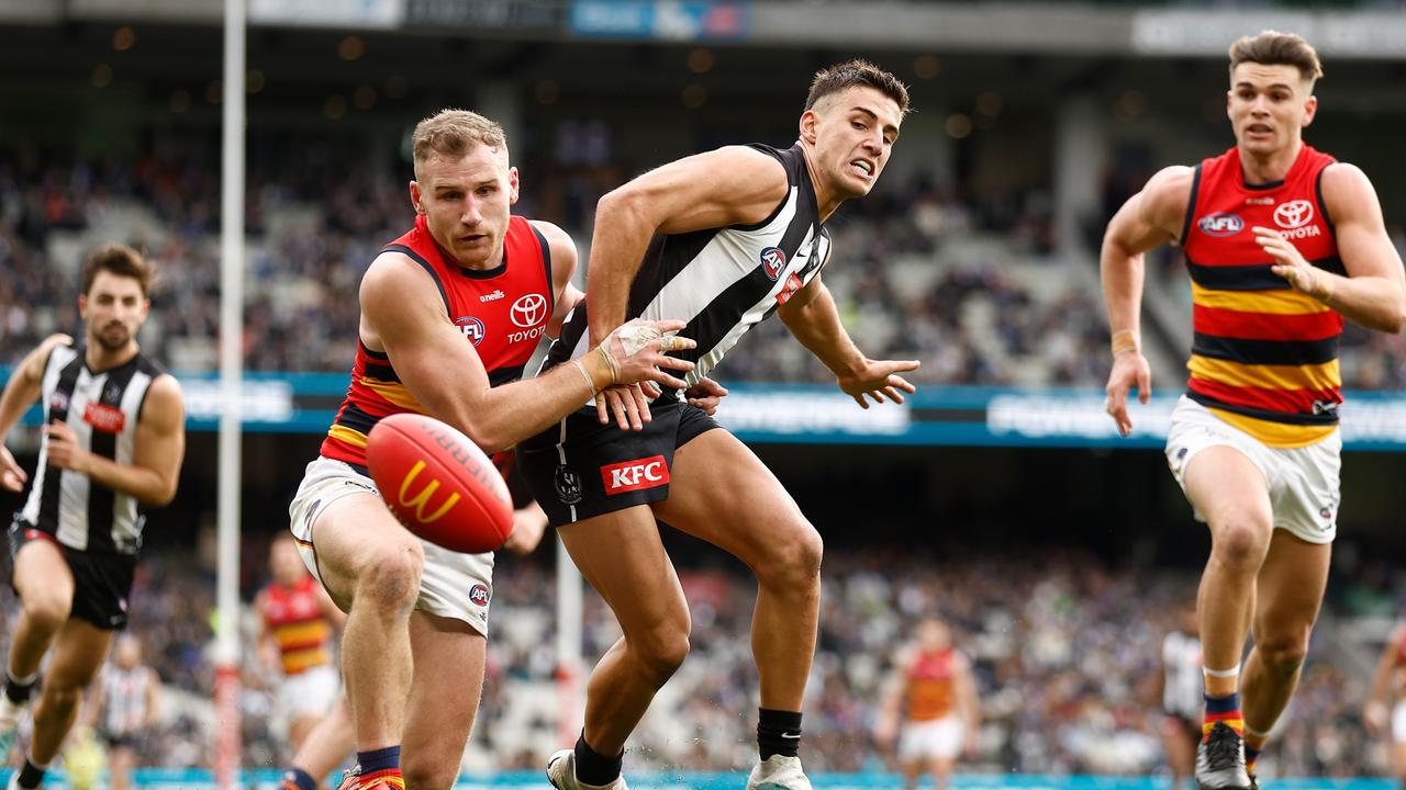 Rory Laird tackles Collingwood star Nick Daicos. Picture: Michael Willson/AFL Photos via Getty Images