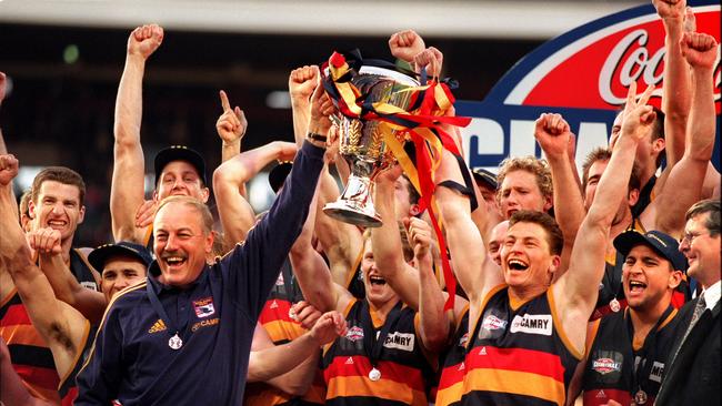 Malcolm Blight holding the premiership cup with captain Mark Bickley in 1998.