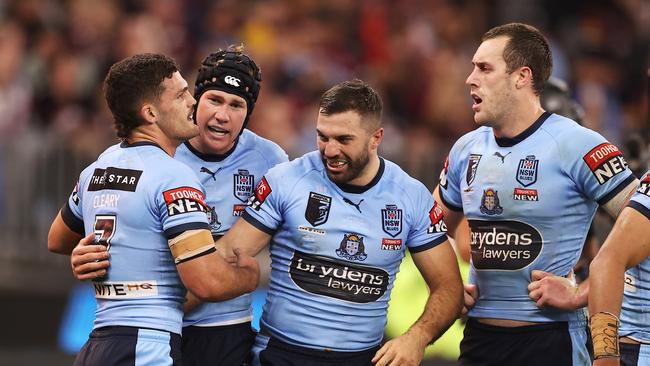 PERTH, AUSTRALIA – JUNE 26: Matt Burton of the Blues celebrates with teammates after scoring a try during game two of the State of Origin series between New South Wales Blues and Queensland Maroons at Optus Stadium, on June 26, 2022, in Perth, Australia. (Photo by Mark Kolbe/Getty Images)