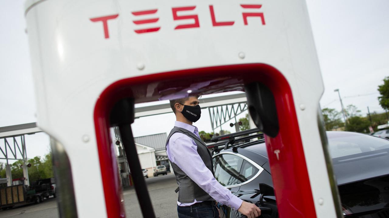 Ben Rich charges his Tesla vehicle at a super charging station in Parsippany, New Jersey. Picture: Kena Betancur / AFP