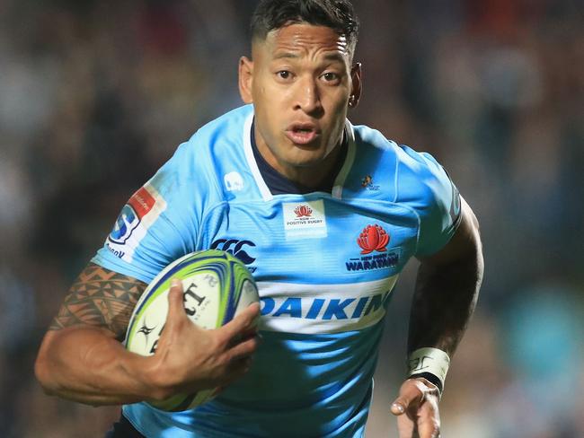 SYDNEY, AUSTRALIA - MAY 05: Israel Folau of the Waratahs breaks free from the tackle of Ross Wright of the Orbyn Leger of the Blues during the round 12 Super Rugby match between the Waratahs and the Blues at Lottoland on May 5, 2018 in Sydney, Australia.  (Photo by Mark Evans/Getty Images)