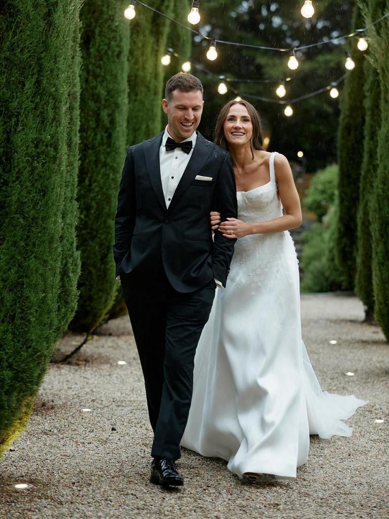 A wet and woolly day didn’t dampen the couple’s spirits. Picture: Sebastian Paynter