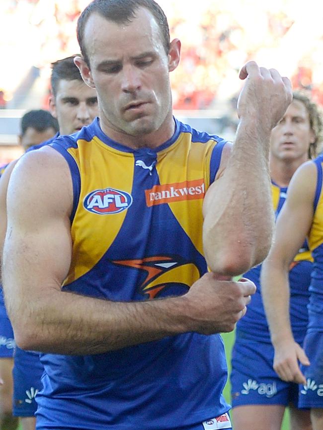 Shannon Hurn leaves the field after Gold Coast’s win.