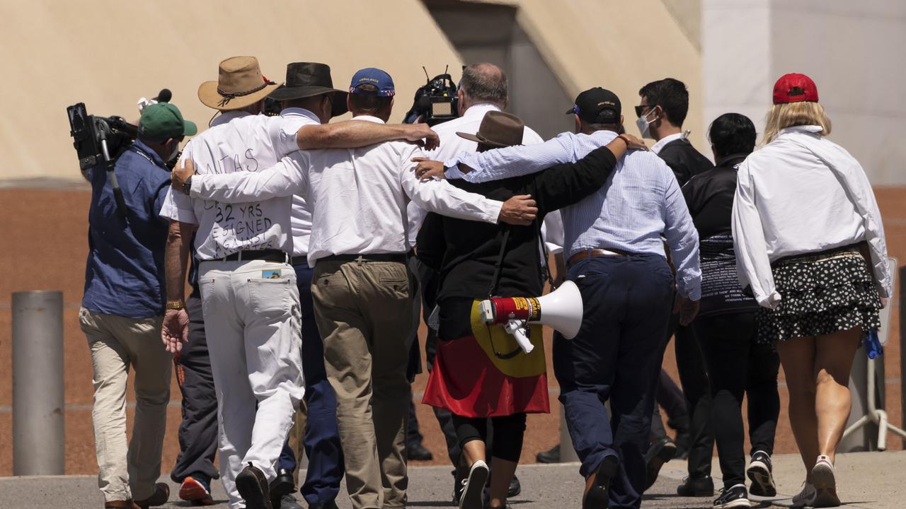 The group being led inside. Picture: Brook Mitchell/Getty Images