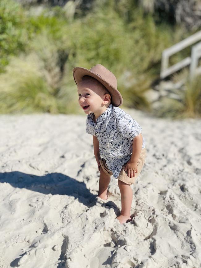 George van Essen enjoys playing at the beach when he’s not in hospital. Picture: Supplied