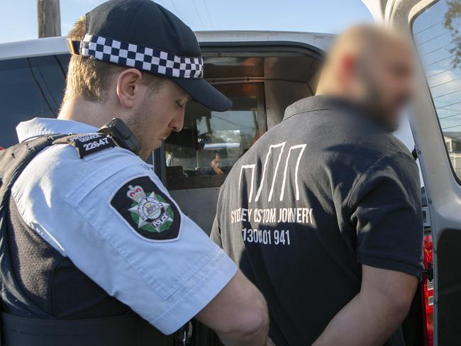 AFP officer arrested two men from Western Sydney.  Picture: AFP