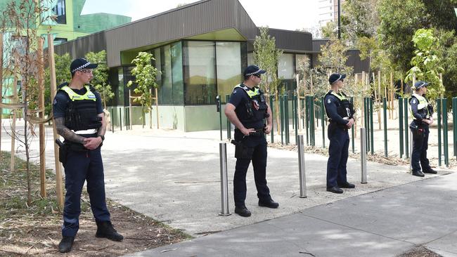 Police stand guard as residents protest against the safe injecting facility in North Richmond Picture: Tony Gough