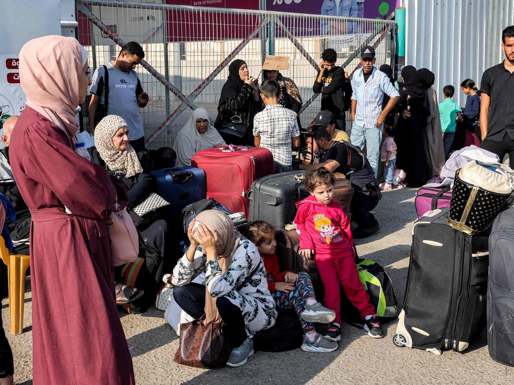 People wait at the Rafah border crossing with Egypt in the southern Gaza Strip. Picture: AFP