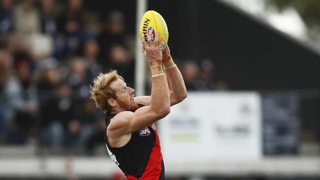 Essendon ruckman Andrew Phillips rises to mark against Geelong in Colac.