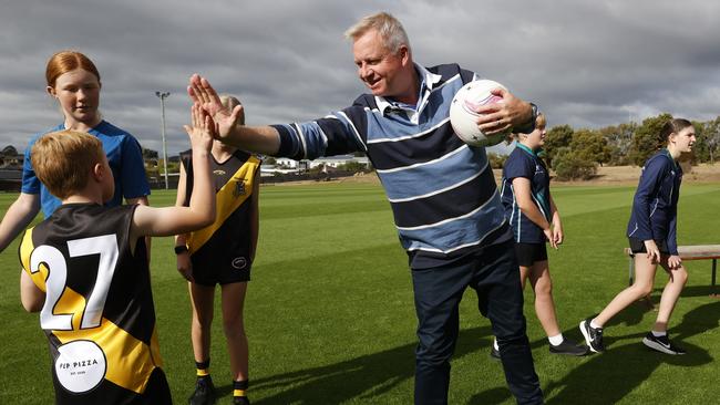 Premier Jeremy Rockliff gives Cooper Dobson 7 from Kingborough Tigers Junior Football Club a high five. Premier Jeremy Rockliff in Kingston in relation to a junior sport announcement. Picture: Nikki Davis-Jones