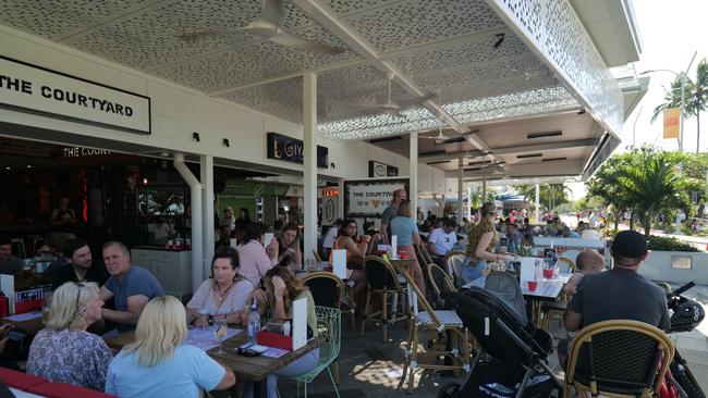 Cafes and restaurants along the Cairns Esplanade experiencing an influx in foot traffic from the Cairns Ironman event. Photo: Georgia Clelland.