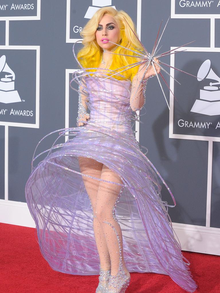 Lady Gaga arrived dressed as the fairy on your Christmas tree at the 2010 Grammys. Picture: Getty