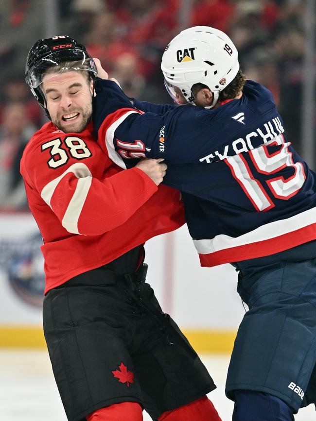 Matthew Tkachuk fights Brandon Hagel. Photo by Minas Panagiotakis/Getty Images