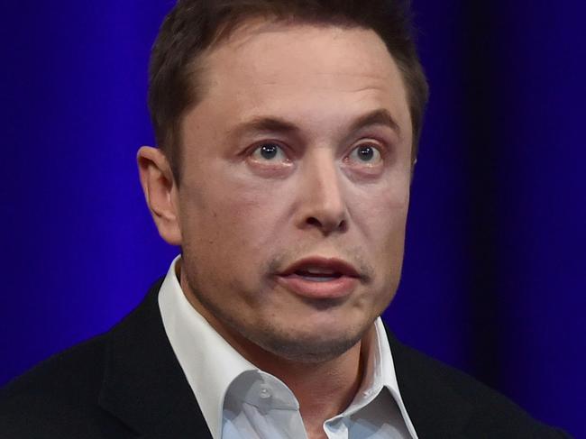 (FILES) In this file photo taken on September 29, 2017 Billionaire entrepreneur and founder of SpaceX Elon Musk speaks at the 68th International Astronautical Congress 2017 in Adelaide.  Musk will only get paid if the company's stock soars but would receive a stunning sum if it does, according to a plan approved by shareholders on march 21, 2018. A Tesla spokesperson confirmed that shareholders voted to approve the proposal for a multi-billion-dollar, 10-year performance stock award 