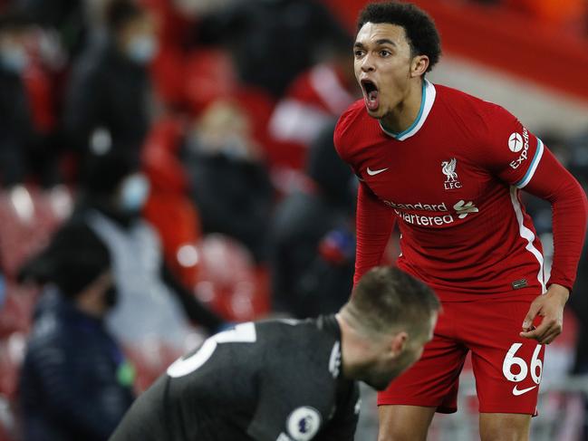 LIVERPOOL, ENGLAND - JANUARY 17: Trent Alexander-Arnold of Liverpool reacts during the Premier League match between Liverpool and Manchester United at Anfield on January 17, 2021 in Liverpool, England. Sporting stadiums around England remain under strict restrictions due to the Coronavirus Pandemic as Government social distancing laws prohibit fans inside venues resulting in games being played behind closed doors. (Photo by Phil Noble - Pool/Getty Images)