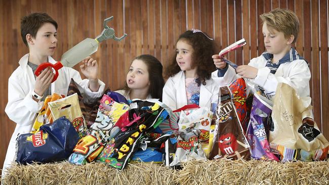 Showbag judges Jasper, 12, Ruby, 10, Paris, 3 and Josh, 11 work their way through some of the hundreds of show bags. Picture: David Caird