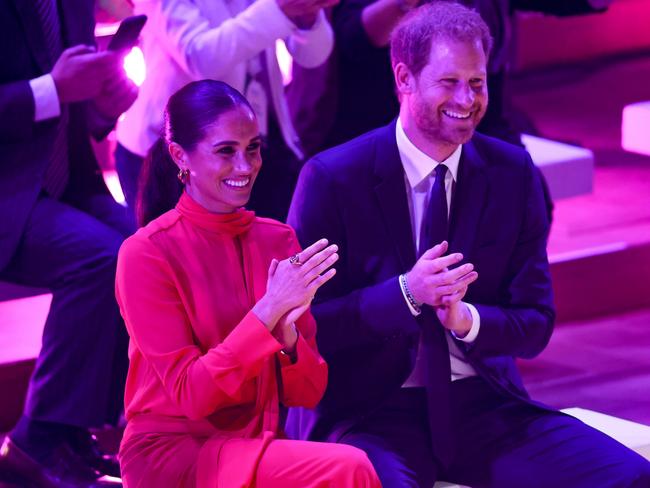 The Duchess of Sussex and Duke of Sussex clap during the Opening Ceremony of the One Young World Summit 2022. Picture: Getty Images