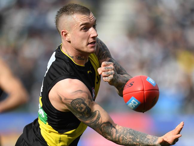 Dustin Martin of the Tigers (right) is seen in action during the Round 21 AFL match between the Geelong Cats and the Richmond Tigers at Simonds Stadium in Geelong, Saturday, August 12, 2017. (AAP Image/Julian Smith) NO ARCHIVING, EDITORIAL USE ONLY