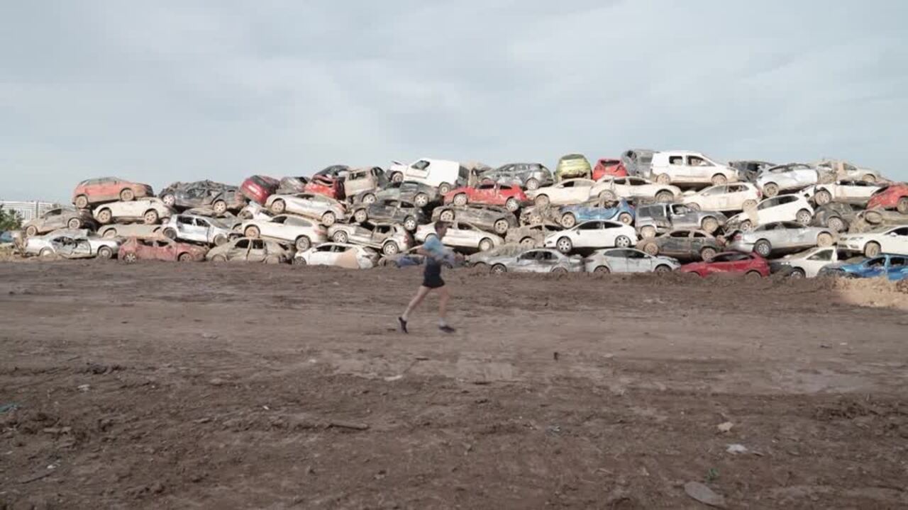 Runners torn on taking part in Valencia marathon in flood-hit city