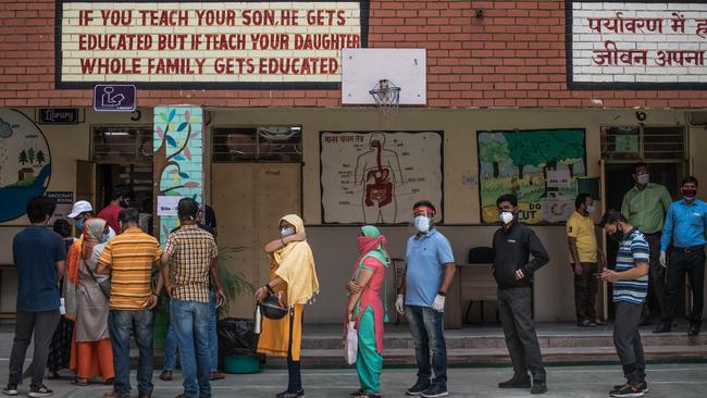 People queue to receive their COVID-19 vaccinations in New Dehli. Picture: Getty