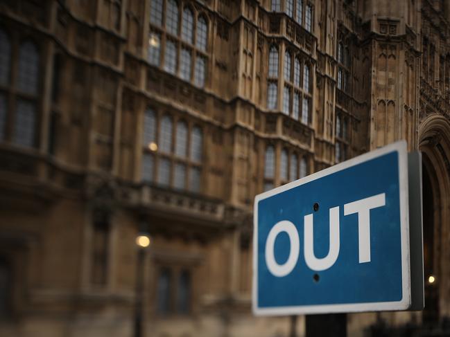 LONDON, ENGLAND - MARCH 14: (EDITORS NOTE: This image was created using a tilt shift lens) A traffic direction sign stands outside the Houses of Parliament on March 14, 2017 in London, England. Reports suggest that Article 50 could be triggered soon and begin the process that will take Britain out of the European Union after parliament has passed the Brexit bill last night. (Photo by Christopher Furlong/Getty Images)