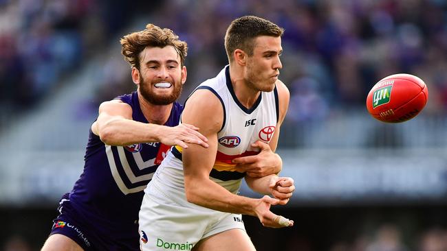 Crows Paul Seedsman is tackled by Fremantle’s Connor Blakely at Optus Stadium on Sunday in Perth. Picture: Daniel Carson/Getty