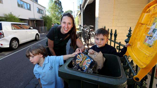 Emily Dickson, 44, with her son Sebastian, 3 and Henry, 5 with a recycling bin in Richmond. Picture: David Geraghty