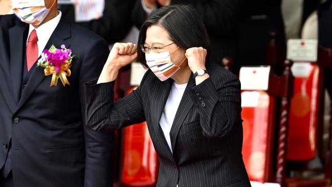 Tsai Ing-wen reviews a fly past of F-16 fighters over her Presidential Office in Taipei on Saturday. Picture: AFP