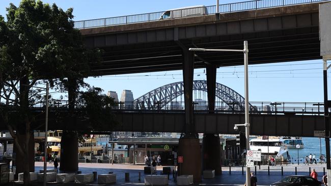 The best and the worst of Sydney architecture – the Cahill Expressway and our beloved Harbour Bridge. Picture: Richard Dobson