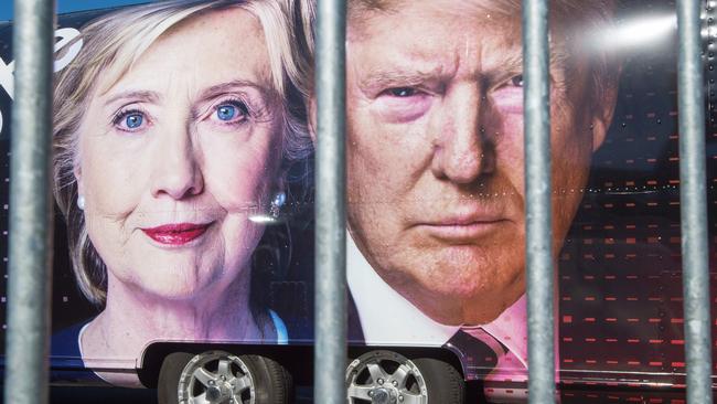 Images of Hillary Clinton and Donald Trump on a CNN vehicle. Picture: AFP.