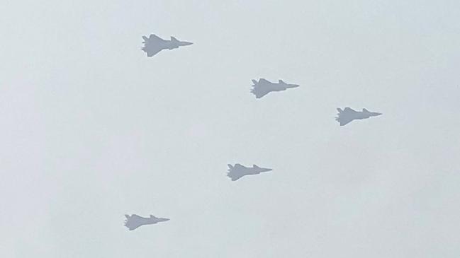 While the West sends words, China sends warplanes. Picture: AFP