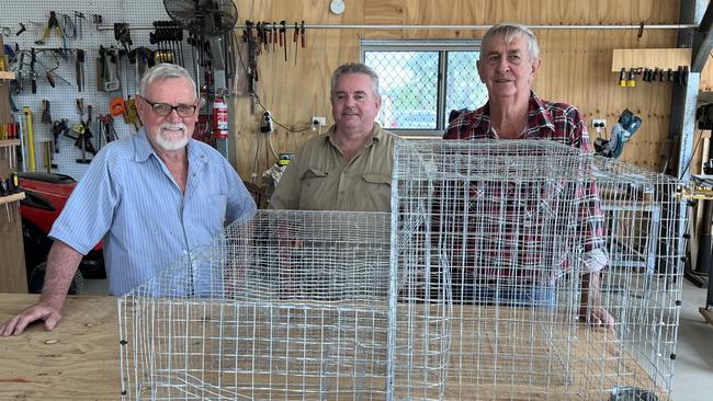 Bowen Men's Shed treasurer, Morrie Wright and members, built three cage traps to help reduce the number of Indian mynas bred. Photo: Contributed