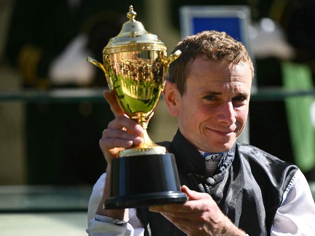 Jockey Ryan Moore poses with the trophy after winning The Gold Cup race with Kyprios on the third day of the Royal Ascot horse racing meeting, in Ascot, west of London, on June 20, 2024. Picture: AFP