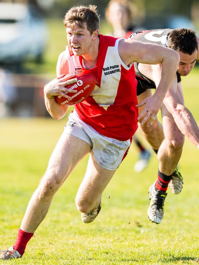 Red Hill’s Peter Dal Lago breaks a tackle against Frankston Bombers. Picture Stuart Walmsley