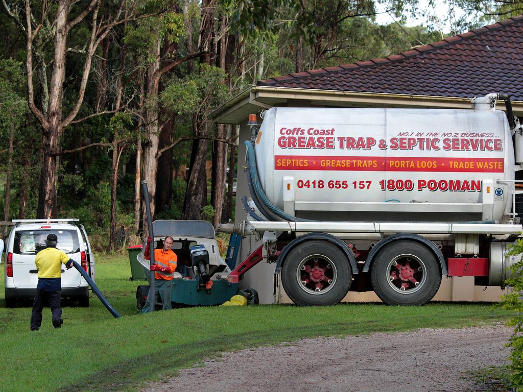 A septic tank at Bonny Hills is drained and searched in January 2015. Picture: Nathan Edwards.