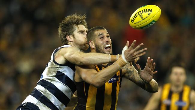 Geelong’s Tom Lonergan with Lance Franklin in his Hawthorn days.