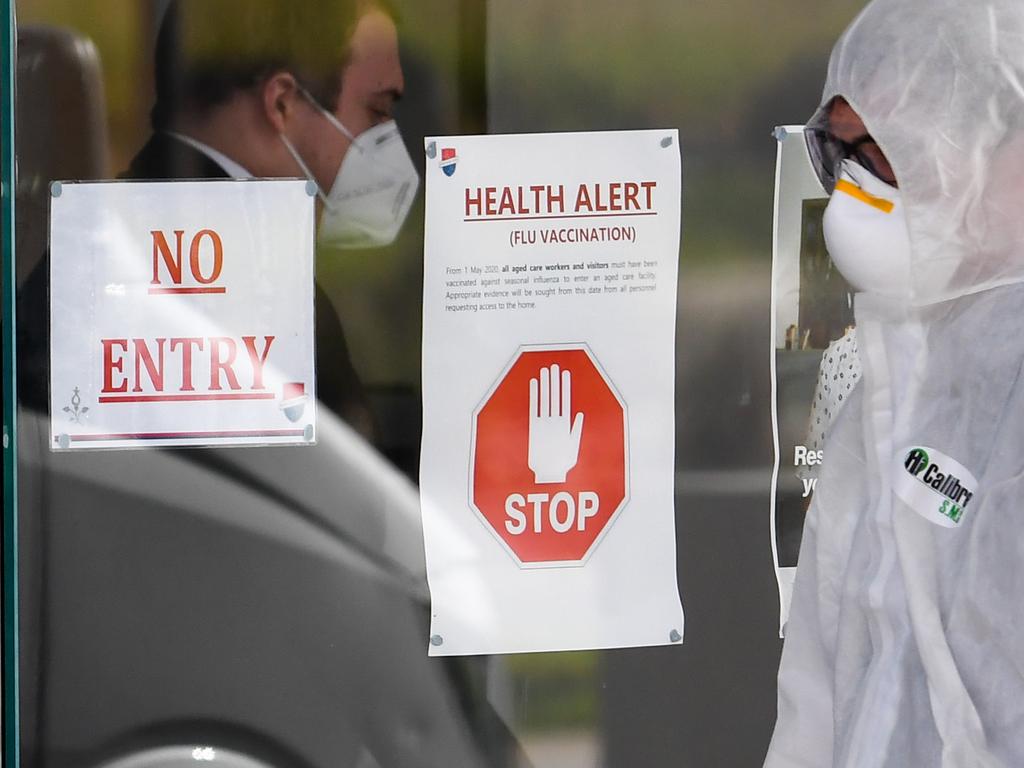 A medical worker enters the Epping Gardens aged care facility in Melbourne. Picture: William West / AFP