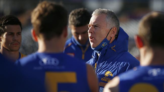 Eagles head coach Adam Simpson speaks to his players.