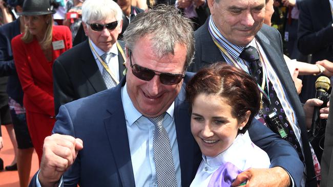 Michelle Payne celebrates the hug victory with trainer Darren Weir. Picture: AAP