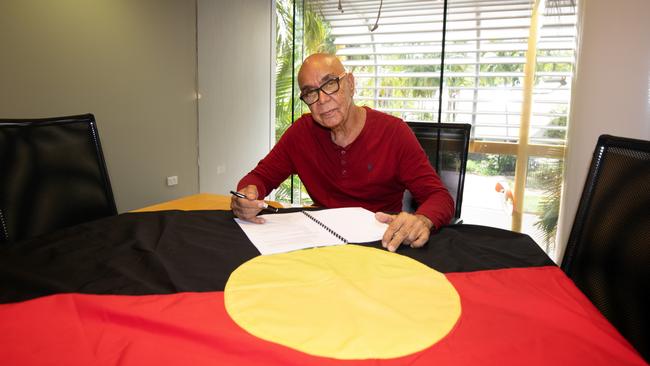 Aboriginal flag artist Harold Thomas signs the copyright over to the federal government Picture: David Hancock