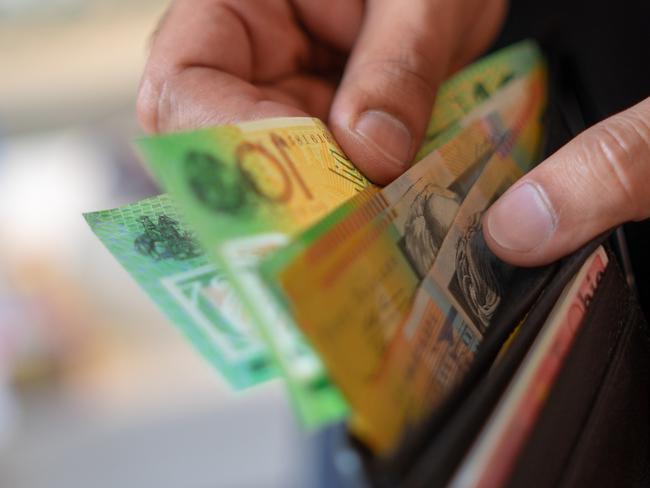 a male taking money out of the valet.  Picture: istock