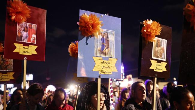 Arizona for Abortion Access supporters carry photographs of women who died because of abortion bans in Georgia and Texas during the 35th annual All Souls Procession two days before Election Day on November 3. Picture: Mario Tama/Getty Images/AFP