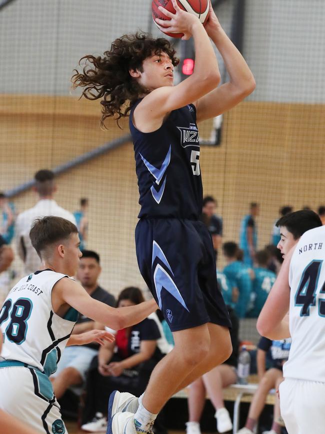 Basketball Queensland Under-16 Boys State Championships at the Coomera Indoor Sports Centre.Northside Wizards (Navy) v North Gold Coast Seahawks . Wizards Kaylan Jackson soars over Seahawks Picture Glenn Hampson