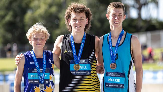 Steeplechase U 16 winner Nicholas McGill from Nowra Athletics Club with silver medallist Harrison McClusky from Gosford Allstars Athletics and bronze medallist Ethan Mackie from Sutherland.