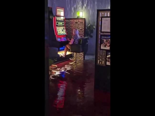 Woman keeps playing pokies during cyclone Alfred