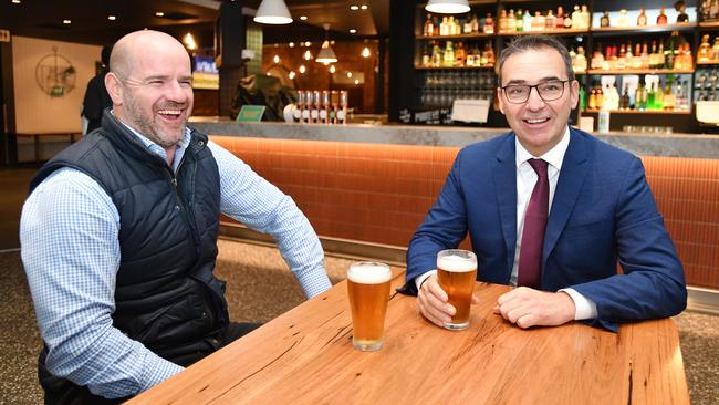 Former Crows star and Alma Hotel owner with SA Premier Steven Marshall celebrating the reopening of pubs in SA. Picture: AAP / David Mariuz