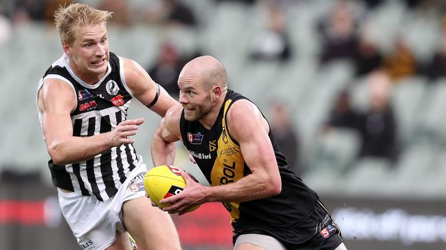 Billy Frampton chases Glenelg’s Aaron Joseph during the Second Semi-Final. Picture SARAH REED