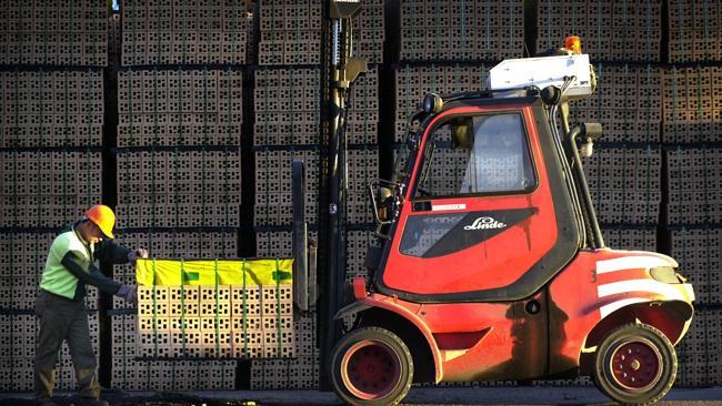 Bingh Duong checks loading of bricks on forklift at Boral Brickworks at Bringelly, southwest of Sydney in 2003. (Picture: Alan Pryke)
