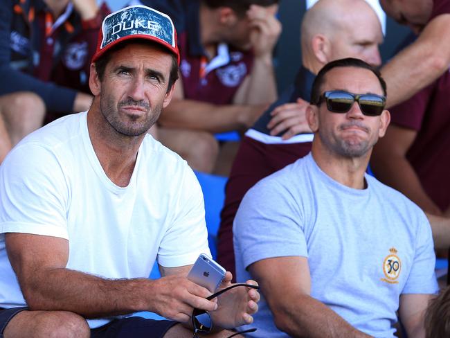 SHARKS V SEA EAGLES in a pre season NRL game at Pittwater Park in North Narrabeen today. Ex players and brothers Andrew (left) and Matthew Johns watch the game.