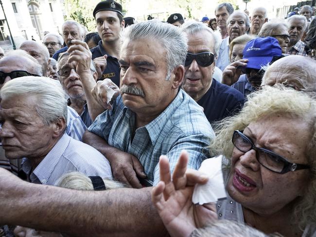 Crowd crush ... Pensioners line up outside a National Bank branch. Picture: Milos Bicanski/Getty Images